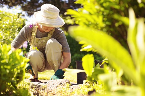 Inspector measuring garden waste volume before providing a quote